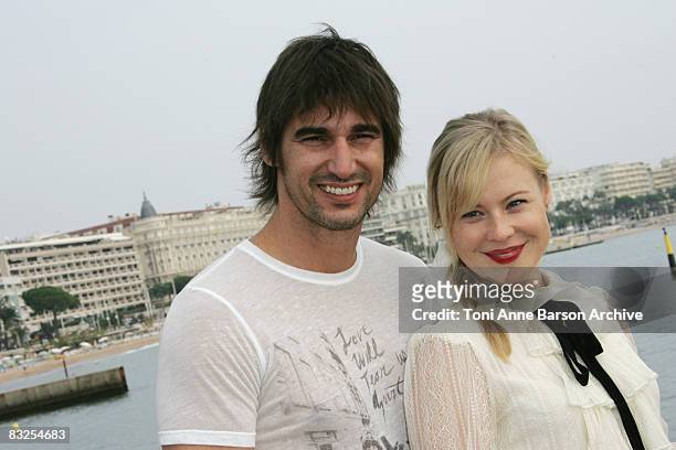 Kristin Booth and Peter Miller pose for the TV serie "The Secret Lives of Hockey Wives" during MIPCOM at the Majestic Pier on October 13, 2008 in...