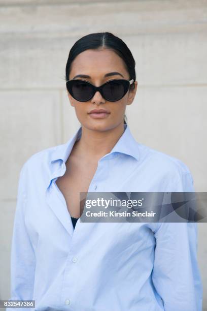 Shoe designer Amina Muaddi wears a Loro Piana shirt with Roberi and Fraud sunglasses and Oscar Tiye shoes day 2 of Paris Haute Couture Fashion Week...