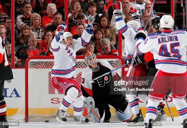 Martin Biron of the Philadelphia Flyers looks dejected as the New York Rangers celebrate a 1st period goal on October 11, 2008 at the Wachovia Center...