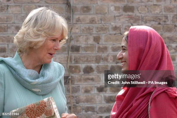 The Duchess of Cornwall talks to a student at the Fatima Jinnah college in Rawalpindi, Pakistan.