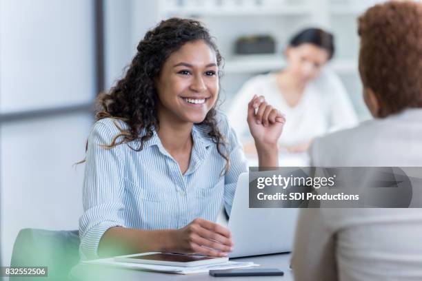 young businesswoman meets with client - admin assistant stock pictures, royalty-free photos & images