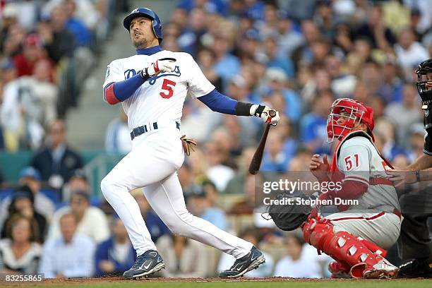 Nomar Garciaparra of the Los Angeles Dodgers swings at a pitch in Game Three of the National League Championship Series against the Philadelphia...