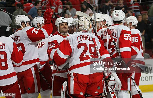 Ty Conklin of the Detroit Redwings celebrates with teammates after defeating the Carolina Hurricanes at RBC Center on October 13, 2008 in Raleigh,...