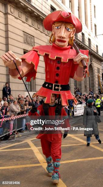 One of the many participants of the Lord Mayors show walks past the Mansion House in the City of London.