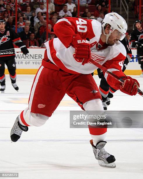 Pittsburgh Penguins defenseman Sergei Gonchar (55) skates away as Detroit Red Wings' Henrik Zetterberg (C) and Pavel Datsyuk (13) celebrate Zetterberg's goal during the third period of game 1 of the Stanley