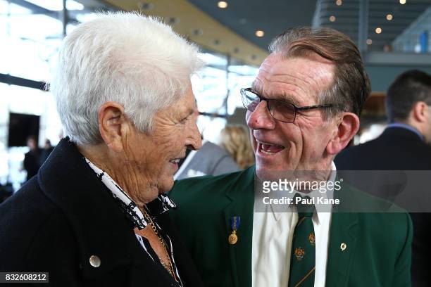 Dawn Fraser shares a moment with Henk Vogels during the funeral service for Betty Cuthbert at Mandurah Performing Arts Centre on August 16, 2017 in...