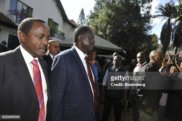 Raila Odinga, opposition leader for the National Super Alliance , center, and Stephen Kalonzo Musyoka, Kenya's former vice president, arrive for a...