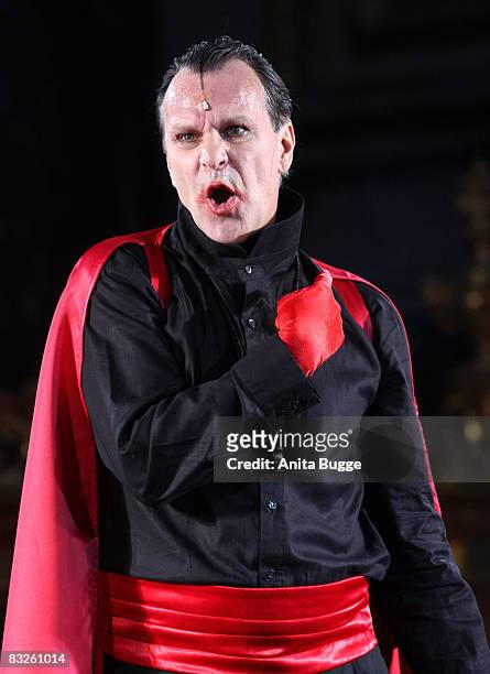 Peter Sattmann as the devil performs during the dress rehearsal for the play "Jedermann" by author Hugo von Hoffmannsthal at the Berlin Cathedral on...