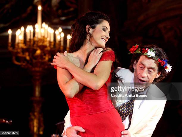 Mariella Ahrens Graefin von Faber-Castell as Buhlschaft and Winfried Glatzeder as Jedermann perform during the dress rehearsal for the play...