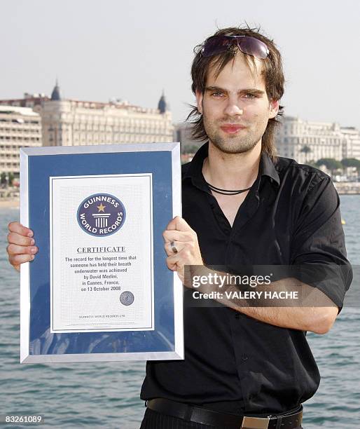 Hungarian artist David Merlini presents his world record certificate at the 24th edition of the five-day MIPCOM, on October 14, 2008 in Cannes,...