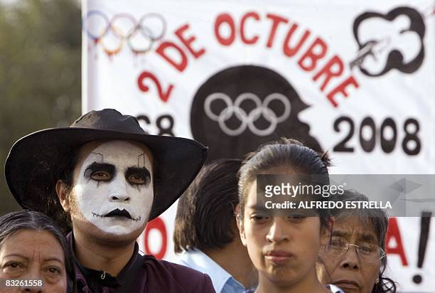 Students take part in a demo during the anniversary of the massacre of Tlatelolco, at the Plaza de las Tres Culturas, in Mexico City, on October 2,...