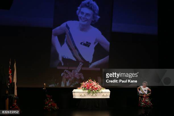 The coffin is seen on the stage together with memorabilia, photographs and floral tributes during the funeral service for Betty Cuthbert at Mandurah...