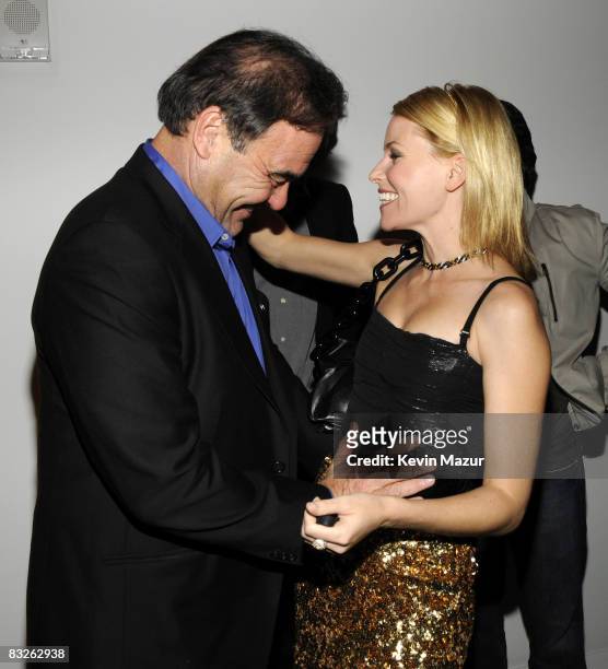 Oliver Stone and Elizabeth Banks attends the Dolce & Gabbana and The Cinema Society Celebration for Madonna and the cast of "Filth and Wisdom" at The...