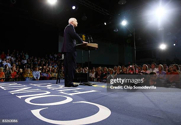 Republican presidential candidate Sen. John McCain points to the crowd during a rally at Montgomery County Community College October 14, 2008 in Blue...