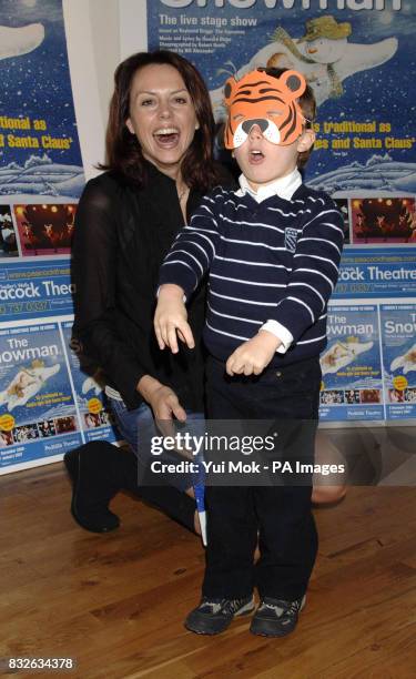 Beverley Turner and son Croyde arrive for the VIP press launch of The Snowman, at the Peacock Theatre in central London.