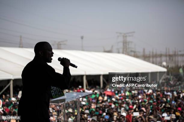 South Africa's Democratic Alliance opposition party leader Mmusi Maimane addresses the crowd as members of the Association of Mineworkers and the...