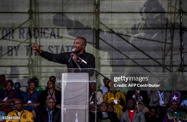 South Africa's Democratic Alliance opposition party leader Mmusi Maimane addresses the crowd as members of the Association of Mineworkers and the...