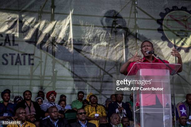 Economic Freedom Fighters leader Julius Malema addresses the crowd as members of the Association of Mineworkers and the Marikana community gather to...