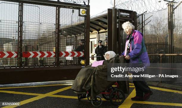 Alice Beer and her friend Liz Brandow protest outside Faslane on the River Clyde, Scotland, the Trident nuclear submarine base.