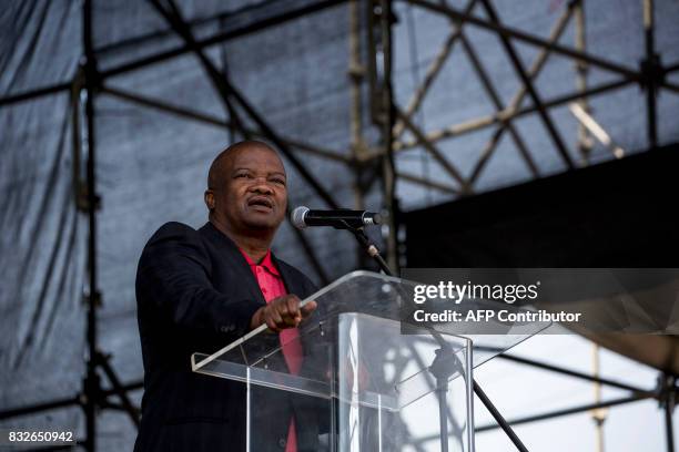 South Africa's United Democratic Movement party leader Bantu Holomisa addresses the crowd as members of the Association of Mineworkers and the...