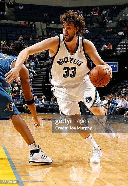 Marc Gasol of the Memphis Grizzlies drives past Etan Thomas of the Washington Wizards during the preseason game on October 8, 2008 at FedExForum in...