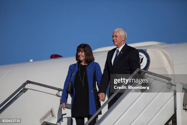 Vice President Mike Pence, right, and his wife Karen Pence stand for photographs before departing from Palomar Air Base in Buenos Aires, Argentina,...