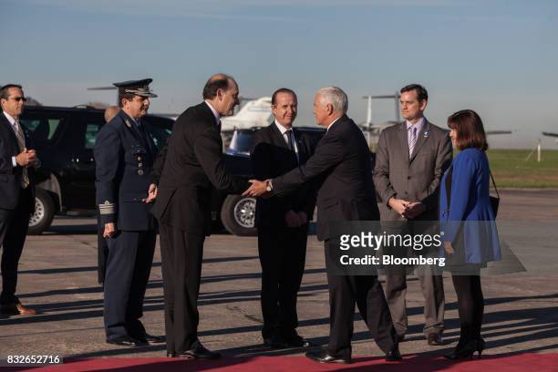 Vice President Mike Pence, third right, shakes hands with Daniel Raimundi, Argentina's vice minister of foreign affairs, third left, while departing...