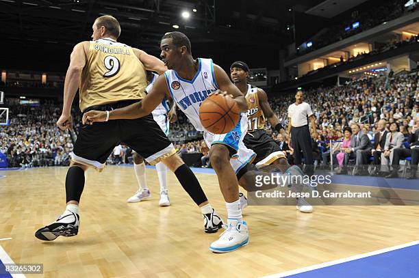 Chris Paul of the New Orleans Hornets dribbles against the Washington Wizards during the 2008 NBA Europe Live Tour on October 14, 2008 at the 02...