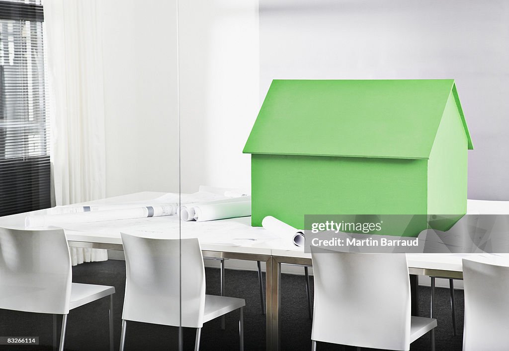 Small model house on conference table