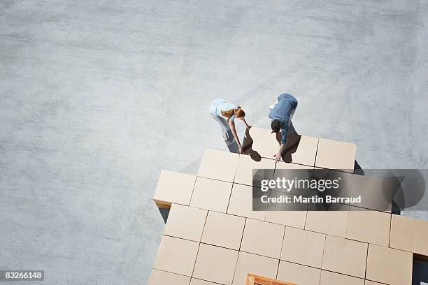 couple building house outline on sidewalk - responsibility stock pictures, royalty-free photos & images