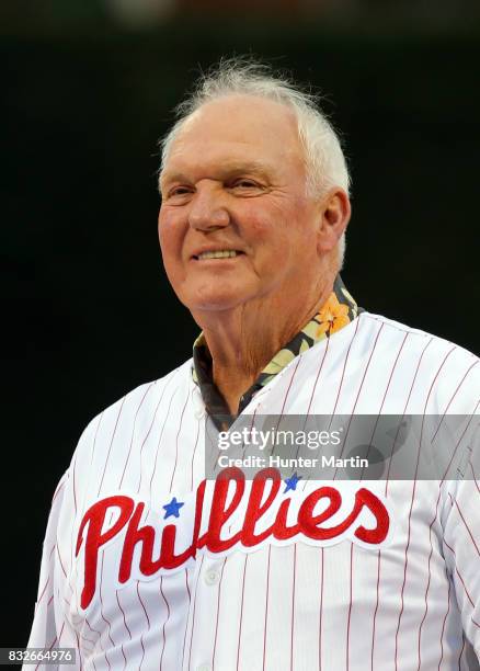 Former Philadelphia Phillies manager, Charlie Manuel smiles as he stands on the field during the Wall of Fame ceremony before a game between the...