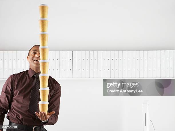 https://media.gettyimages.com/id/83266518/photo/businessman-balancing-large-stack-of-paper-coffee-cups.jpg?s=612x612&w=gi&k=20&c=mpatWDBJaBRNOPP5nQUOBl-f2mWJUFraanSprhHyb98=