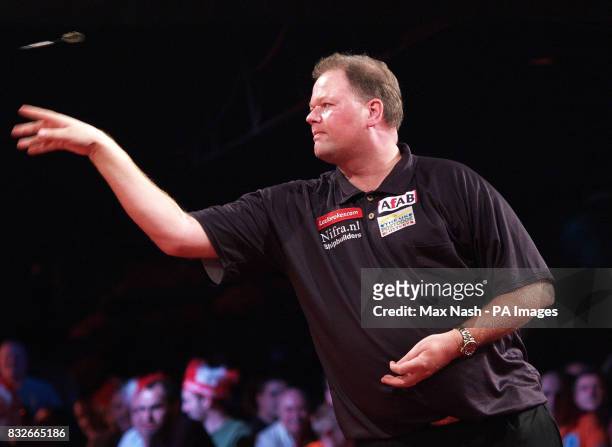 Netherland's Raymond van Barneveld in action against England's Andy Jenkins during the semi-final of the PDC Ladbrokes.com World Championships at...