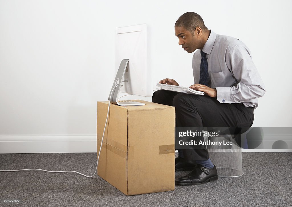 Businessman working on makeshift desk