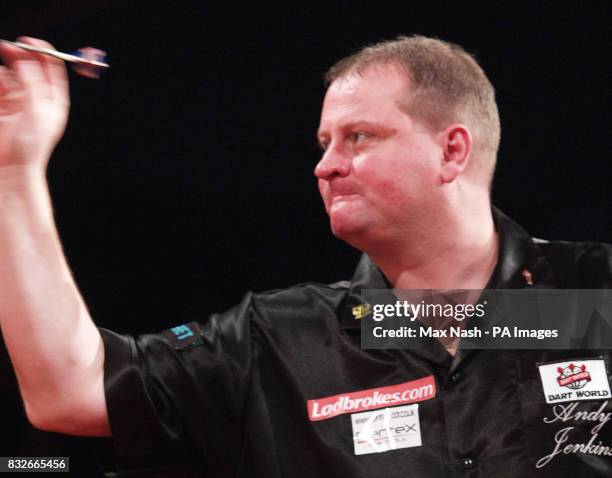 England's Andy Jenkins against Raymond van Barneveld during the semi-final of the PDC Ladbrokes.com World Championships at Purfleet, Essex.