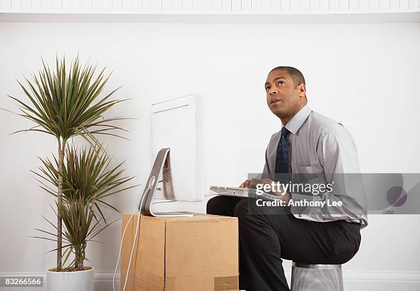 businessman working on makeshift desk - makeshift office stock pictures, royalty-free photos & images