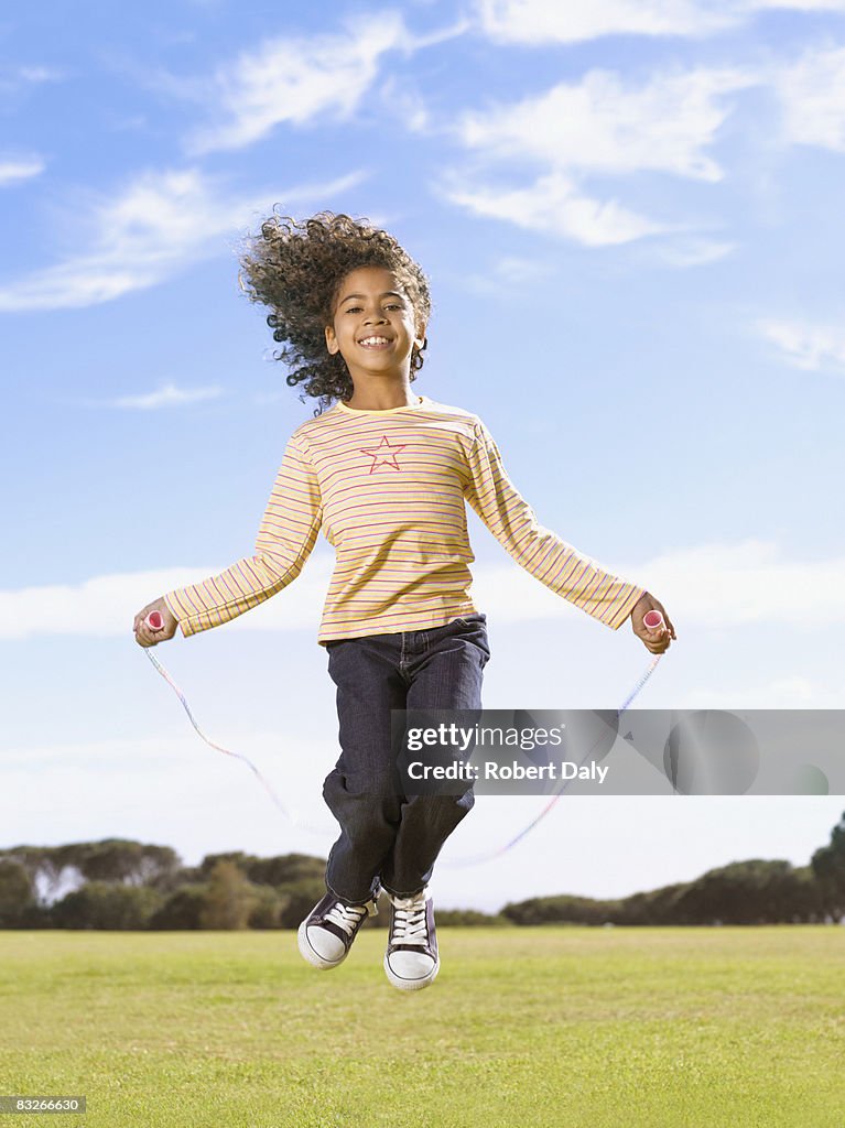 Young girl jumping rope