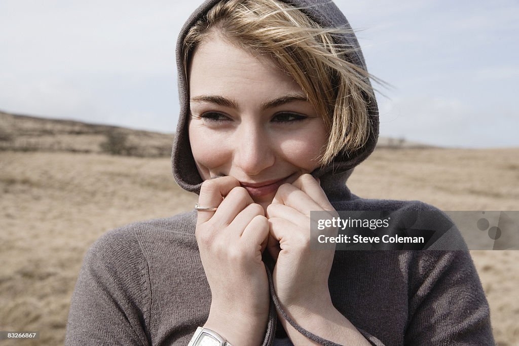 Teenage girl in hooded sweater