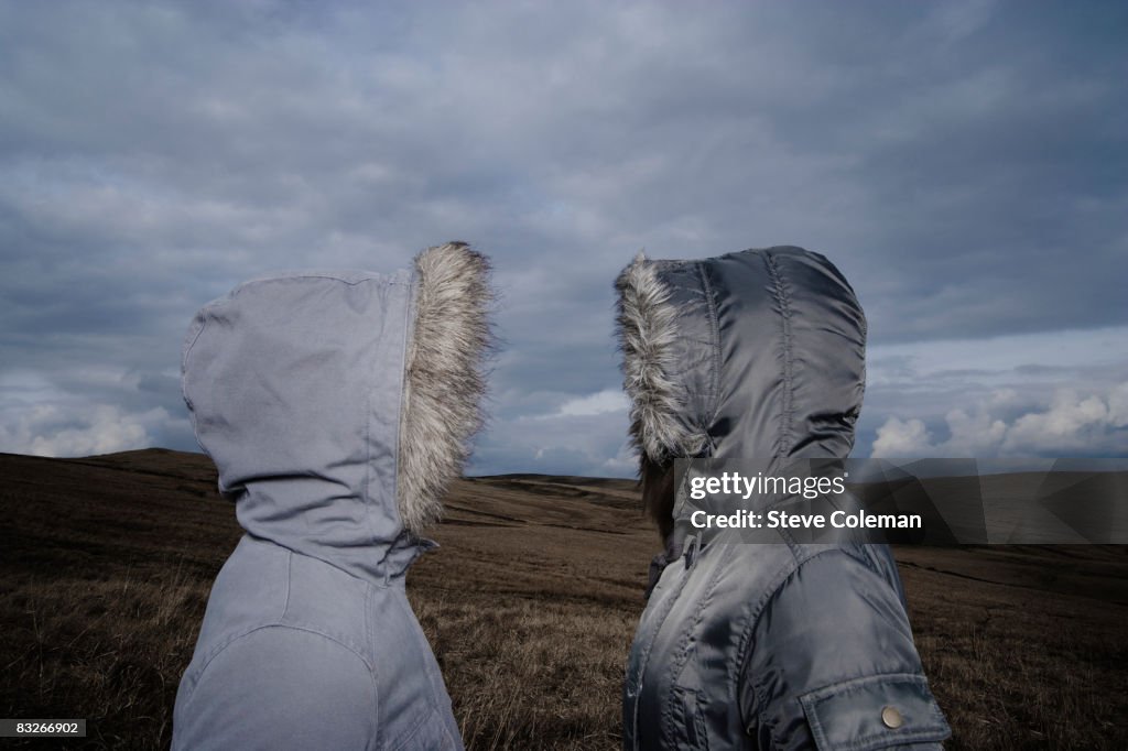 Teenage girls in fur hooded coats