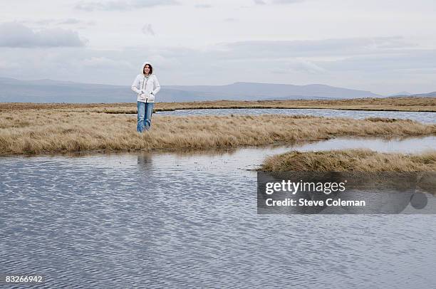 teenage girl standing near stream - brooke coleman stock pictures, royalty-free photos & images