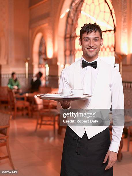 waiter in exotic cafe - waiter ストックフォトと画像