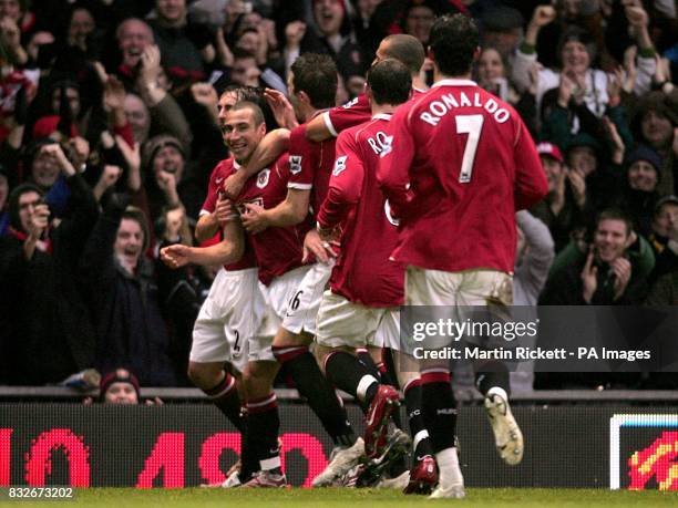 Manchester United's Henrik Larsson celebrates his goal.