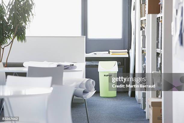 green recycling bin in office - office recycling stock pictures, royalty-free photos & images