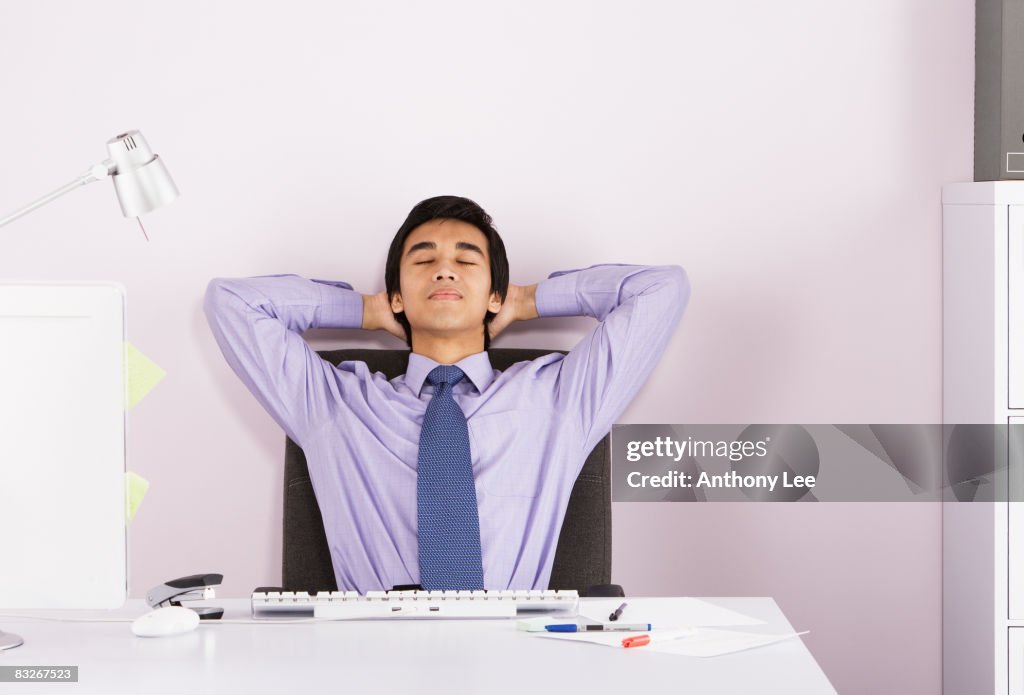 Businessman relaxing at desk