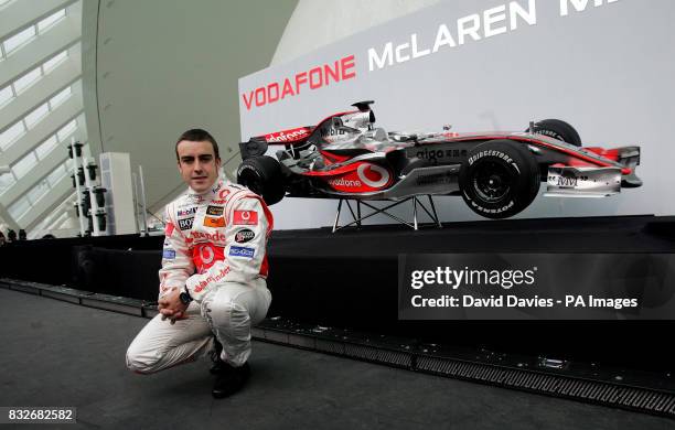 Vodafone McLaren Mercedes driver World Champion Fernando Alonso poses with the new McLaren MP4-22 Formula 1 car during the launch in L'Hemisferic,...