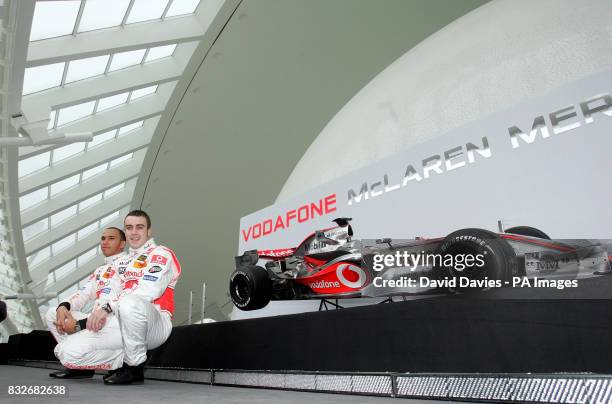 Vodafone McLaren Mercedes drivers Lewis Hamilton and World Champion Fernando Alonso pose with the new McLaren MP4-22 Formula 1 car at it's launch in...