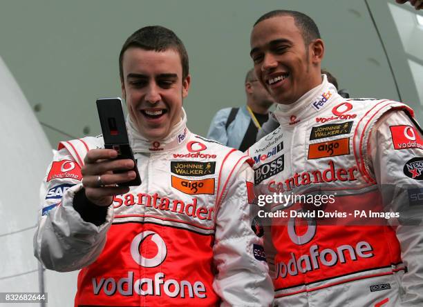 Vodafone McLaren Mercedes drivers Lewis Hamilton of Great Britain, and World Champion Fernando Alonso of Spain , are unveiled during the photocall of...