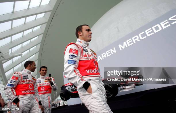 Vodafone McLaren Mercedes driver and World Champion Fernando Alonso of Spain , walks off ahead of Lewis Hamilton of Great Britain in front of the new...