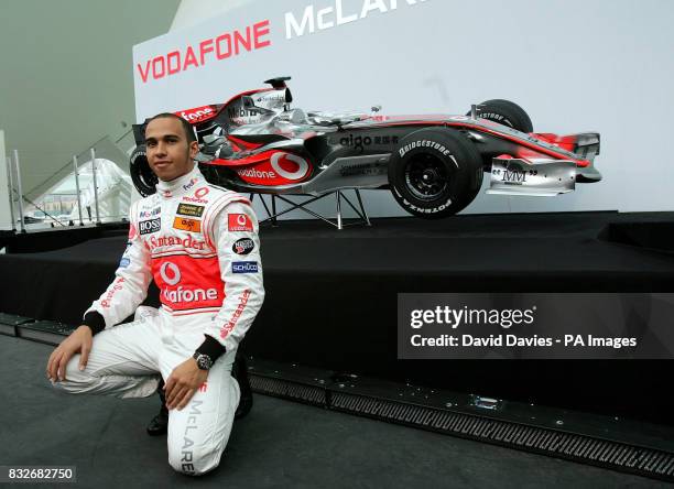 Vodafone McLaren Mercedes drivers Lewis Hamilton of Great Britain poses with the new McLaren MP4-22 Formula One car during the launch in...