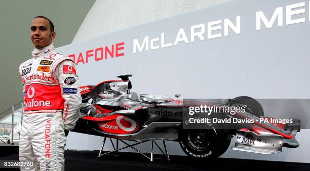 Vodafone McLaren Mercedes drivers Lewis Hamilton poses with the new McLaren MP4-22 Formula One car during the launch in L'Hemisferic, Ciudad de las...